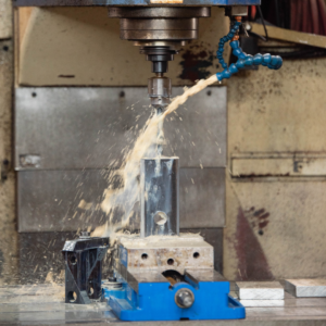 Alan uses a water jet to create parts for our clients' projects